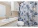 Bathroom featuring a single sink vanity, cabinet, and a shower with geometric curtain at 522 Knollwood Dr, Stockbridge, GA 30281