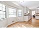 Corner of kitchen with hardwood floors, views of windows, and access to dining area at 522 Knollwood Dr, Stockbridge, GA 30281