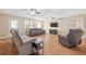 Spacious living room with hardwood floors, neutral colors and several ceiling fans at 522 Knollwood Dr, Stockbridge, GA 30281