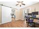 Office featuring a sliding barn door entrance and a view into the kitchen area at 522 Knollwood Dr, Stockbridge, GA 30281