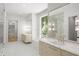 Elegant bathroom with dual sinks, a soaking tub, and a walk-in shower at 2515 Habersham Rd, Atlanta, GA 30305