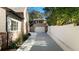 Long driveway leading to a detached garage with a white privacy wall at 2515 Habersham Rd, Atlanta, GA 30305