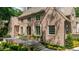 Two-story brick home with a beautiful entrance and multiple windows with white trim at 2515 Habersham Rd, Atlanta, GA 30305