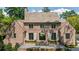 Elegant brick home with a symmetrical facade and black trimmed windows offers timeless appeal at 2515 Habersham Rd, Atlanta, GA 30305