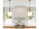 Close-up of designer light fixtures over a marble backsplash and professional grade stovetop at 2515 Habersham Rd, Atlanta, GA 30305
