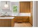 Bright, open kitchen with marble backsplash, wood cabinets, and sleek hardware at 2515 Habersham Rd, Atlanta, GA 30305