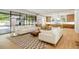 Sun-filled living room featuring hardwood floors and an open floor plan flowing into the kitchen at 2515 Habersham Rd, Atlanta, GA 30305