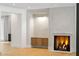 Bright and inviting living room with a built in cabinet and a modern fireplace with herringbone firebox at 2515 Habersham Rd, Atlanta, GA 30305