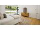 Spacious main bedroom featuring hardwood floors and backyard views through large windows at 2515 Habersham Rd, Atlanta, GA 30305