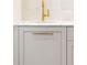 Stylish bathroom sink features a white marble countertop and a modern gold faucet and hardware at 2515 Habersham Rd, Atlanta, GA 30305