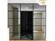 Sophisticated wine cellar featuring sleek glass doors and a contemporary design, perfect for wine enthusiasts at 2515 Habersham Rd, Atlanta, GA 30305