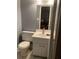 Neutral bathroom with modern sink and vanity offering good storage space at 3315 Canterbury Trl, Rex, GA 30273