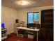 Home office featuring built in bookcase and a dedicated workspace with ample natural light at 3315 Canterbury Trl, Rex, GA 30273