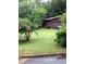Charming single-story home with well-manicured lawn, mature landscaping and attached garage at 3315 Canterbury Trl, Rex, GA 30273