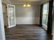 Formal dining room with decorative molding, chandelier, and natural light at 500 Kings Pl, Riverdale, GA 30296