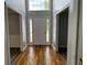 Entryway featuring hardwood flooring and a view into the living and dining rooms at 500 Kings Pl, Riverdale, GA 30296