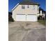 Two-car garage with driveway at 500 Kings Pl, Riverdale, GA 30296