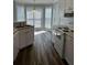 Bright kitchen boasting modern appliances, ample cabinet space, and a charming breakfast nook overlooking the backyard at 500 Kings Pl, Riverdale, GA 30296