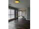 Living room featuring hardwood floors, natural light, and neutral walls at 500 Kings Pl, Riverdale, GA 30296