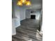 Living room featuring stylish hardwood floors and a fireplace at 500 Kings Pl, Riverdale, GA 30296