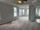 Spacious main bedroom with large windows and a ceiling fan at 500 Kings Pl, Riverdale, GA 30296