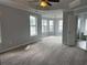 Spacious main bedroom with large windows and a ceiling fan at 500 Kings Pl, Riverdale, GA 30296