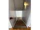 Carpeted stairway leading to an upper level with natural light at 500 Kings Pl, Riverdale, GA 30296