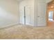Spacious bedroom featuring neutral carpet, a double closet, and natural light at 614 Harrington Hls, Decatur, GA 30032