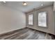 Bedroom with hardwood floors, recessed lighting, and two bright windows at 614 Harrington Hls, Decatur, GA 30032