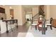 Cozy dining area next to the kitchen with modern black bar stools and wooden round dining table at 614 Harrington Hls, Decatur, GA 30032