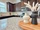 Well-appointed kitchen featuring granite counters, stainless steel appliances, and ample cabinetry at 614 Harrington Hls, Decatur, GA 30032