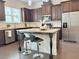 Modern kitchen featuring an island, stainless appliances, and ample counter space at 614 Harrington Hls, Decatur, GA 30032