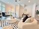 Bright living room with stylish furniture, dark wood floors, and staircase at 614 Harrington Hls, Decatur, GA 30032