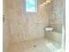Beautiful walk-in shower with tile walls, glass doors and built in shower seat at 614 Harrington Hls, Decatur, GA 30032