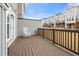 Cozy back deck offers a relaxing outdoor space with a white rocking chair and a view of the neighborhood at 1098 Caruso Dr, Buford, GA 30518