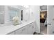Bright bathroom with white double vanity, modern fixtures, and an attached bedroom at 1098 Caruso Dr, Buford, GA 30518