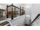 Inviting entryway with hardwood stairs, a white front door, and a view to the dining area at 1098 Caruso Dr, Buford, GA 30518