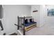 Upstairs hallway features a cushioned bench with throw pillows, stairs, and neutral carpet at 1098 Caruso Dr, Buford, GA 30518