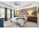 This main bedroom features stylish wall trim, carpeted floors, and a large comfortable bed at 1098 Caruso Dr, Buford, GA 30518