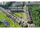 Aerial view of a residential community with townhomes, green spaces, and mature trees at 1112 Cordia Nw Ave, Atlanta, GA 30318