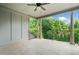 Spacious tiled balcony with white columns and railing overlooking lush trees at 1112 Cordia Nw Ave, Atlanta, GA 30318