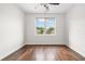 Bright bedroom with hardwood floors, ceiling fan, ample natural light, and neutral walls at 1112 Cordia Nw Ave, Atlanta, GA 30318