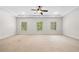 Spacious carpeted bedroom with ceiling fan and natural light at 1112 Cordia Nw Ave, Atlanta, GA 30318