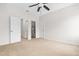 Spacious bedroom with carpet and multiple doors, including access to the bathroom and closet at 1112 Cordia Nw Ave, Atlanta, GA 30318