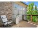 Relaxing deck with comfortable seating, exterior brick accent wall, and views of the surrounding greenery at 1112 Cordia Nw Ave, Atlanta, GA 30318