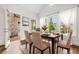 Bright dining room features a modern table setting, large windows with sheer curtains, and patio access at 1112 Cordia Nw Ave, Atlanta, GA 30318