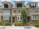 Townhome exterior with stone and brick facade, and private balconies at 1112 Cordia Nw Ave, Atlanta, GA 30318