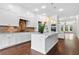 Beautiful kitchen with an island, white cabinets, and stainless steel appliances at 1112 Cordia Nw Ave, Atlanta, GA 30318