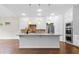 Bright, spacious kitchen with white cabinets, stainless steel appliances, and an island for meal preparation at 1112 Cordia Nw Ave, Atlanta, GA 30318