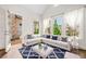 Bright living room featuring a large sectional sofa, hardwood floors, and an outdoor access at 1112 Cordia Nw Ave, Atlanta, GA 30318